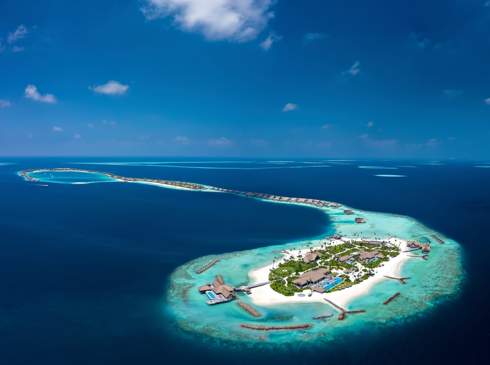 Aerial view of overwater villas in a Maldives lagoon (sample photo)